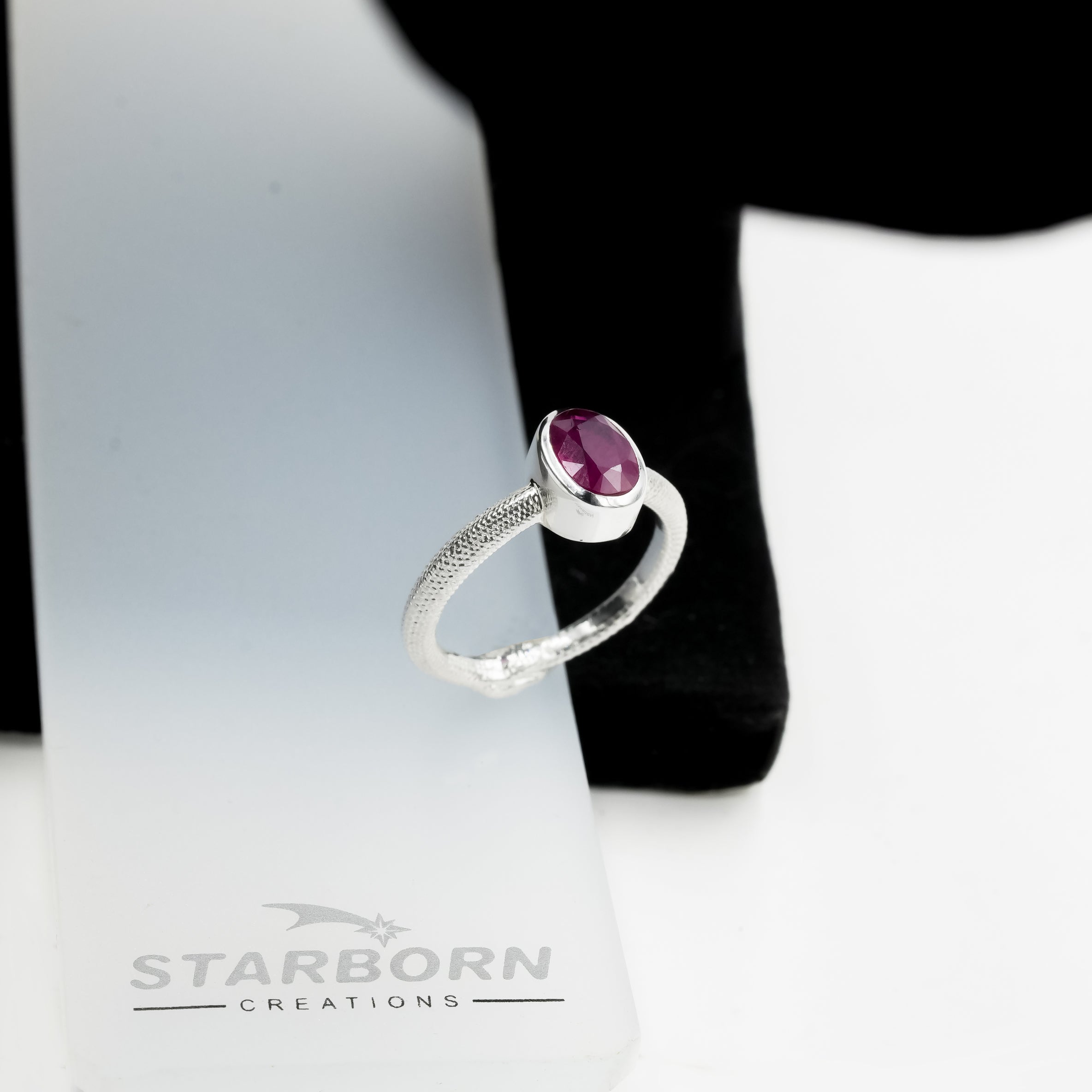 Starborn Ruby Ouroboros Faceted Oval Ring in Fine Sterling Silver